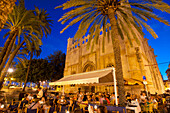 Spain,Majorca,People in cafes and restaurants at dusk,Palma