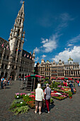 Belgium,Women looking at flowers stalls in Grand Place,Brussels