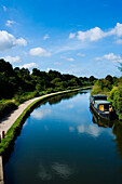 UK.,Hertfordshire,and lush green surrounding countryside,Hemel Hempstead,barge,towpath,The Grand Union Canal