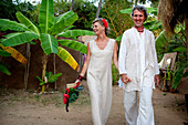 The Bride and groom arrive at Harmonic Healing Centre for their spiritual wedding ceremony,Patnum,Goa,India.