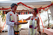 A western couple have a spiritual wedding ceremony at Harmonic Healing Centre,Patnum,Goa,India.