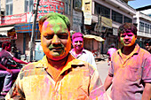During coloured dye throwing Holi festival,Jaipur,capital of Rajasthan,India. Indian festival of Holi,traditionally when India celebrated the end of winter and the beginning of Spring. March. Jaipur,Rajasthan State,India.