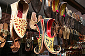 Leather shoes and other tourist goods for sale at this store/ shop near Hawa Mahal City Palace,Jaipur's most distinctive landmark,Jaipur,Rajasthan State,India.