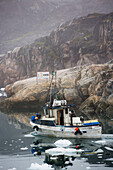 Greenland,Icefjord,Ilulissat,Fishermen going out to sea at Unesco World Heritage Site