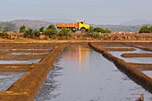 India,Karnataka,Truck Driving Past Shrimp Farm,Gokarna