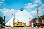 USA,Tennessee,The Pyramid with passing streetcar,Memphis