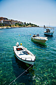 Greece,Halkidiki,Traditional wooden fishing boats moored in small harbour,Pirgadikia