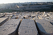 Israel,Tomb stones on Mount of Olives with Old City in Background,Jerusalem