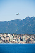 Helicopter Flying Over City,Vancouver Waterfront,Harbor,Vancouver,British Columbia,Canada