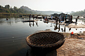 Washing And Cleaning Clothes In The River,Hampi,Karnataka,India