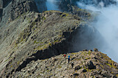 Walkers Going Along Ridge Above Clouds In The Black Cuillin,Isle Of Skye,Scotland