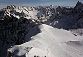 Skiers high atop Aguille du Midi.,Chamonix,France