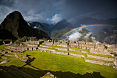 Rainbows form above the ruins of Machu Picchu,Peru