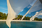 Diaphanous curtains flapping in the breeze at a resort in the Maldives,Republic of the Maldives