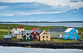 Colourful houses Flatey Island with mountains and water in the background,in the Breidafjordur area of the Westfjords,Iceland,Iceland