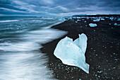 Iceberg from Jokulsarlon lagoon on a black sand beach,Iceland