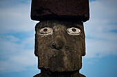 Close-up of a Moai against a blue sky with cloud at Rapa Nui National Park on Easter Island,Easter Island