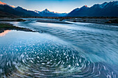 Slow shutter speed captures the motion of the Tasman River coming off the Tasman Glacier,South Island,New Zealand