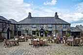 Guests enjoying the outside restaurant patio at Smugglers Bar and Hotel,Jamaica Inn,Bodmin Moor,Launceston,Cornwall,England