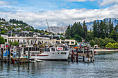 Queenstown pier and neighbouring mountain slopes,Queenstown,South Island,New Zealand