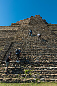 Tourists climbs the steep stone steps at Tonina,the pre-Columbian archaeological site and ruined city of the Maya civilization,Chiapas,Mexico