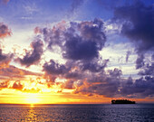 Dramatic sunset over a small island in the South Pacific,Bora Bora,French Polynesia