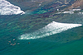 Surfers waiting for a wave,off the coast of Southwest Sri Lanka,Sri Lanka