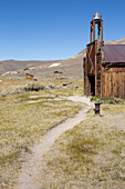 A beaten path leads to the abandoned fire station in Bodie Ghost Town.,Bodie State Historic Park,Bridgeport,California