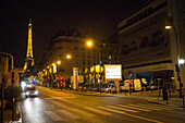 The Eiffel Tower and Paris streets at night.,Paris,France