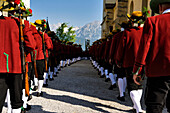 Lining up outside the Mary Immaculate parish church in Weerberg village,local people in traditional clothing,celebrate Herz-Jesu with a procession.,Austria.