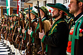 Lining up outside the Mary Immaculate parish church in Weerberg village,riflemen in traditional clothing,celebrate Herz-Jesu.,Austria.