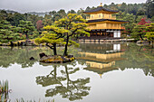 Temple of the Golden Pavilion or Kinkaku-ji is a Zen Buddhist temple in Kyoto,Japan. It is one of the most popular buildings in Kyoto,attracting many visitors annually. It is designated as a National Special Historic Site,a National Special Landscape and is one of 17 locations making up the Historic Monuments of Ancient Kyoto which are World Heritage Sites,Kyoto,Japan