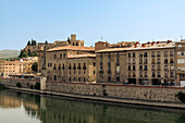 View of the riverbank of Ebro River and Castle of Sant Joan in the background,Tortosa,Spain,Tortosa,Tarragona,Spain