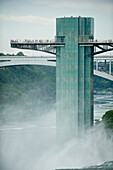 Tourists stand on a lookout tower at Niagara Falls in New York,USA,Niagara Falls,New York,United States of America