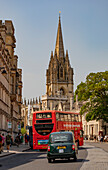 Double-decker bus,pedestrians and University Church of St Mary the Virgin in Oxford,UK,Oxford,England