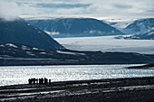 Group on a hike at Faksvagen,Spitsbergen,Svalbard,Norway