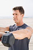 Man Exercising on Beach