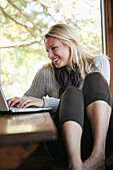 Woman Using a Laptop Computer