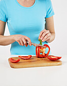 Woman Slicing Red Pepper