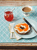Cup of Tea and Red Pepper Jelly and Cream Cheese on Bagel