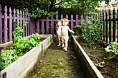 Twin Boys Playing in Garden