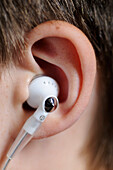 Earbud in Boy's Ear