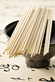 Uncooked Udon Noodles and Bowl