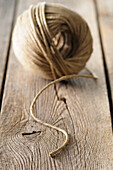Close-up of Ball of Twine on Wooden Board