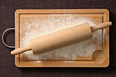 Overhead View of Rolling Pin and Flour on Cutting Board,Studio Shot