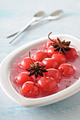 Close-up of Cherries in Syrup with Star Anise,Studio Shot