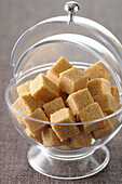 Close-up of Sugar Cubes in Sugar Bowl on Grey Background,Studio Shot