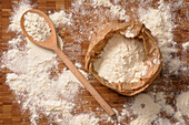 Overhead View of Bag of Flour and Wooden Spoon
