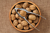 Overhead View of Bowl of Walnuts with Nutcracker