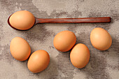 Overhead View of Eggs and Wooden Spoon